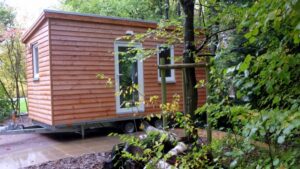 Two Tiny Houses can finance the AWO expenses. The 15 quadratmeter small houses are transportable.